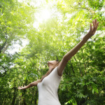woman in woods image by shutterstock