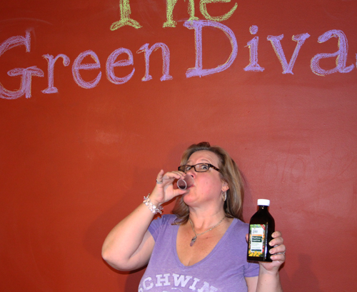 Green Diva Meg taking a shot of Gaia Herbs PlantForce Liquid Iron