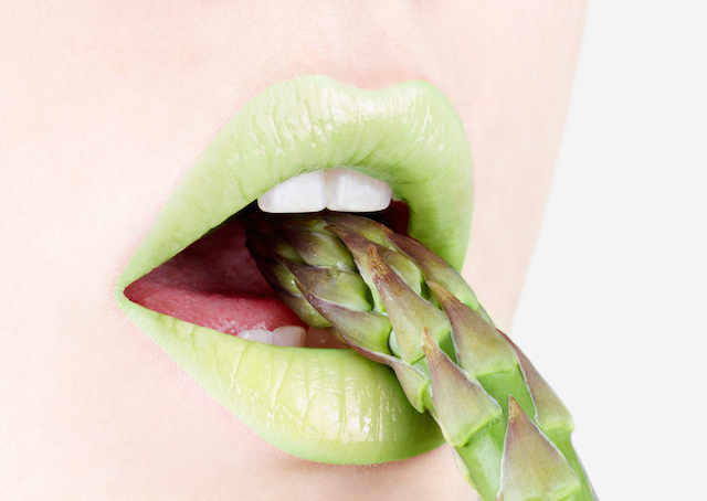 lips eating asparagus