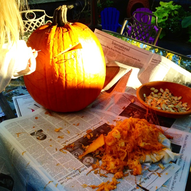 green diva jessie carving a pumpkin