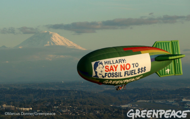Greenpeace image of Hillary Clinton balloon on the green divas