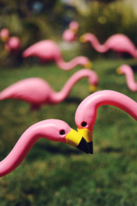 lawns post with pink flamingos
